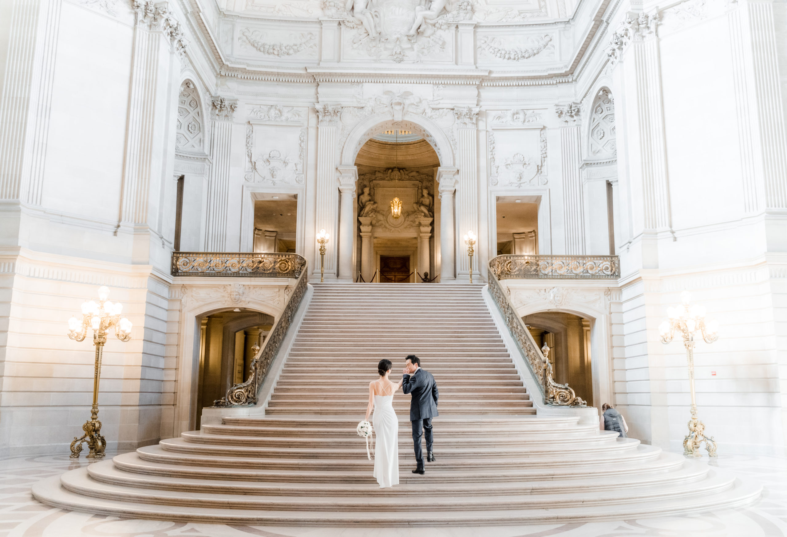 couple walking up stairs at city hall