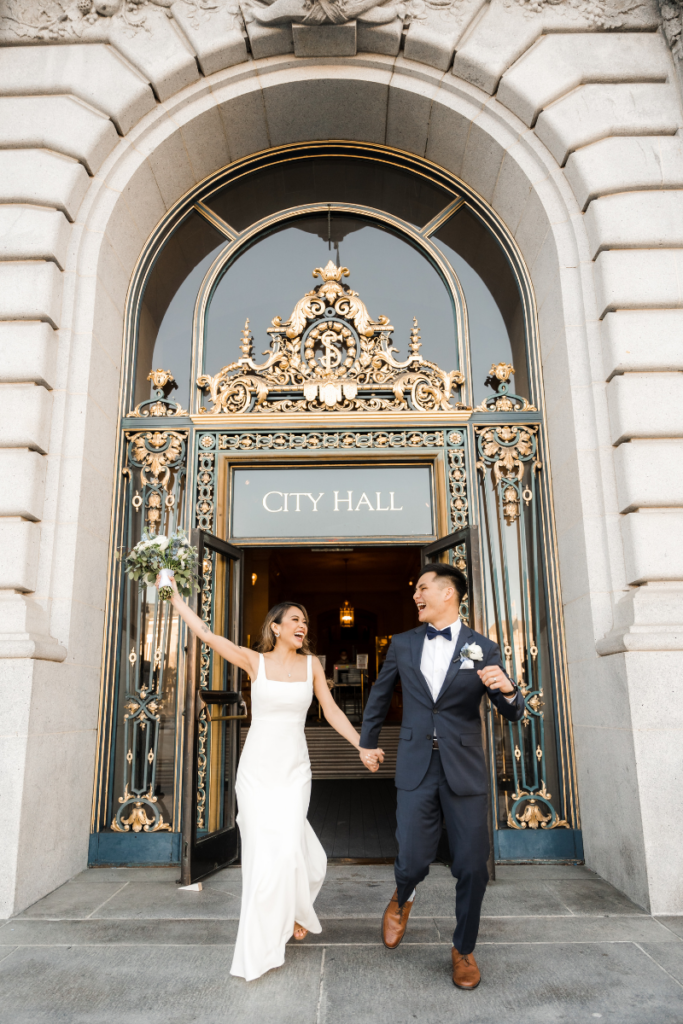 Bride and Groom infront of San Francisco City Hall's entrance
