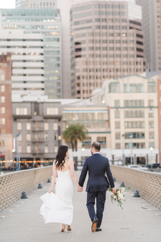 Bride and Groom holding hands after SF Elopement
